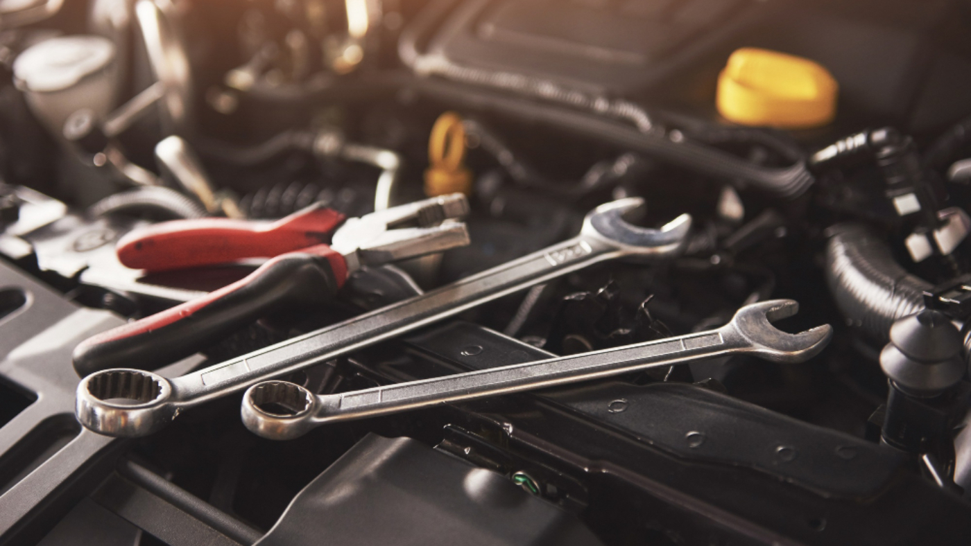 mechanic-hand-checking-fixing-broken-car-car-service-garage